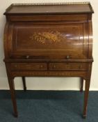 A good mahogany cylinder top bureau with inlaid decoration.