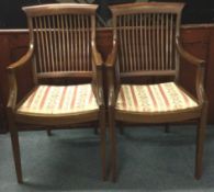 A pair of Edwardian mahogany slack back chairs.