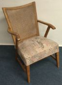 A stylish cane back chair. Est. £20 - £30.