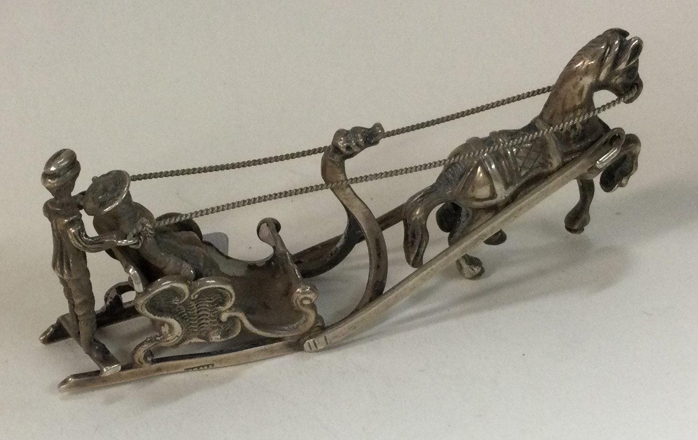 A Dutch silver figure of a horse and carriage.