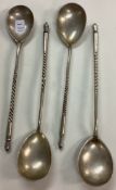 A set of four Russian silver spoons.