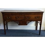 A good early oak three drawer sideboard with brass handles.