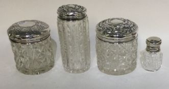 A group of three silver mounted scent bottles.