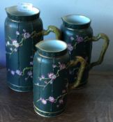 A set of three stoneware jugs with aesthetic decoration.