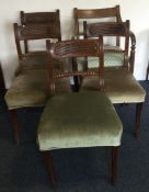 A set of five Victorian mahogany dining chairs on turned supports.