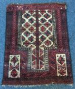 A small red ground rug. Approx. 74 cms x 92 cms.