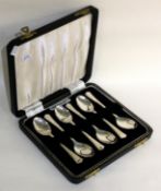A boxed set of six silver handled coffee spoons.