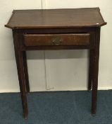 A small Georgian single drawer table on tapering s