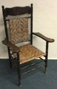 An Edwardian cane seated chair. Est. £20 - £30.