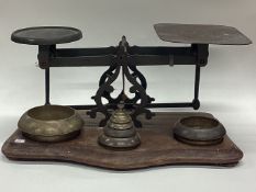 A large pair of chemist scales and weights.