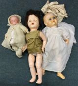 An old German porcelain headed doll with noise box together with two others.