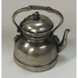 A novelty Continental silver kettle with detachable lid on suspended chain.