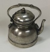 A novelty Continental silver kettle with detachable lid on suspended chain.