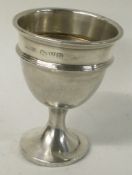 CHESTER: A silver egg cup.