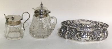 Two silver and glass mounted bottles of shaped form together with an oval trinket box.