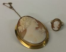 An attractive oval cameo with gold frame together with a cameo ring.