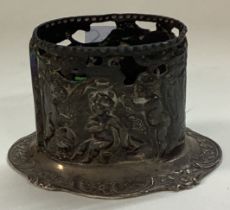 A Continental silver holder pierced with cherubs.