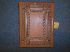 A late Victorian leather photograph album containing approximately 100 various family portraits.