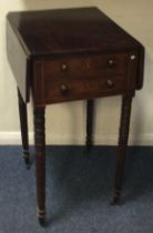 A Victorian mahogany drop leaf sewing table on turned supports.