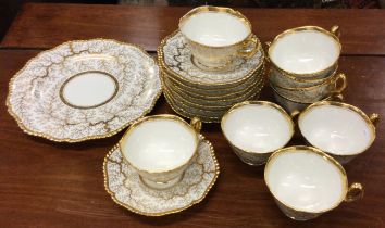 A Flight, Barr & Barr Worcester part tea service with gilt seaweed pattern.