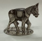 A novelty silver menu holder in the form of a horse.