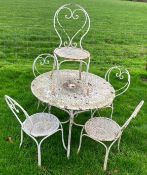 A painted garden table together with matching chairs.