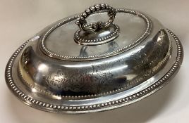 A heavy crested Victorian silver entrée dish and cover.
