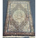 A good quality small rug decorated in bright colours.