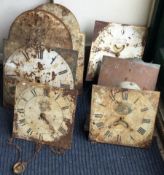 A collection of six painted grandfather clock dials.