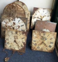A collection of six painted grandfather clock dials.