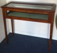A good mahogany hinged top jewellery display cabinet on four tapering supports.