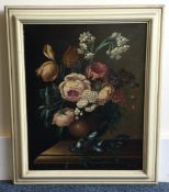 A framed canvas painting depicting still life with flowers.