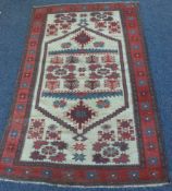 An old tapestry rug. Approx. 108 cms x 191 cms.