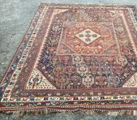 A good Oriental ground carpet / rug decorated in bright colours.