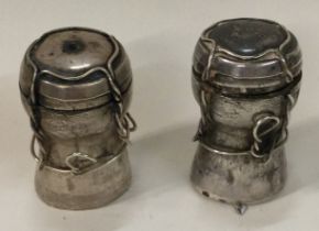 A heavy contemporary silver condiment set comprising of a salt and a pepper pot.