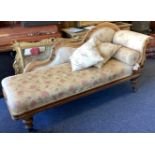 A good Victorian scroll back chaise lounge together with matching cushions.
