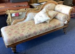 A good Victorian scroll back chaise lounge together with matching cushions.