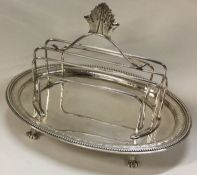 A fine 18th Century Georgian silver toast rack on stand.