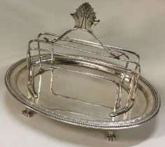 A fine 18th Century Georgian silver toast rack on stand.