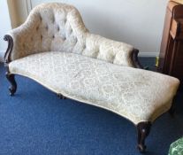 A good large Victorian button back chaise longue of typical form.