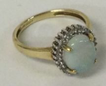 An opal and diamond cluster ring set in 9 carat mount.