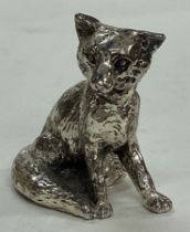 A silver plated figure of an fox.