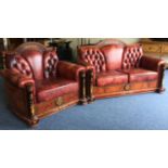 A good quality leather two piece settee suite with inlaid decoration.