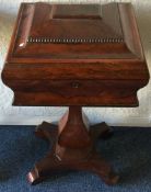 A Victorian rosewood hinged top teapoy.