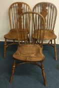 A group of three good reproduction chairs.