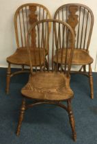 A group of three good reproduction chairs.