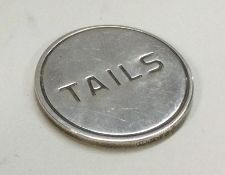 A silver 'heads and tails' marker.