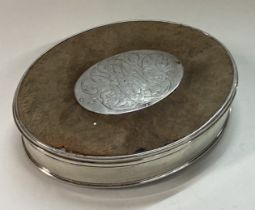 An 18th Century silver, wood and tortoiseshell snuff box with lift-off lid.