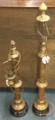 A pair of large brass tapering lamps.