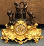 A good French bronze mantle clock heavily decorated with scrolls with gilt dial.